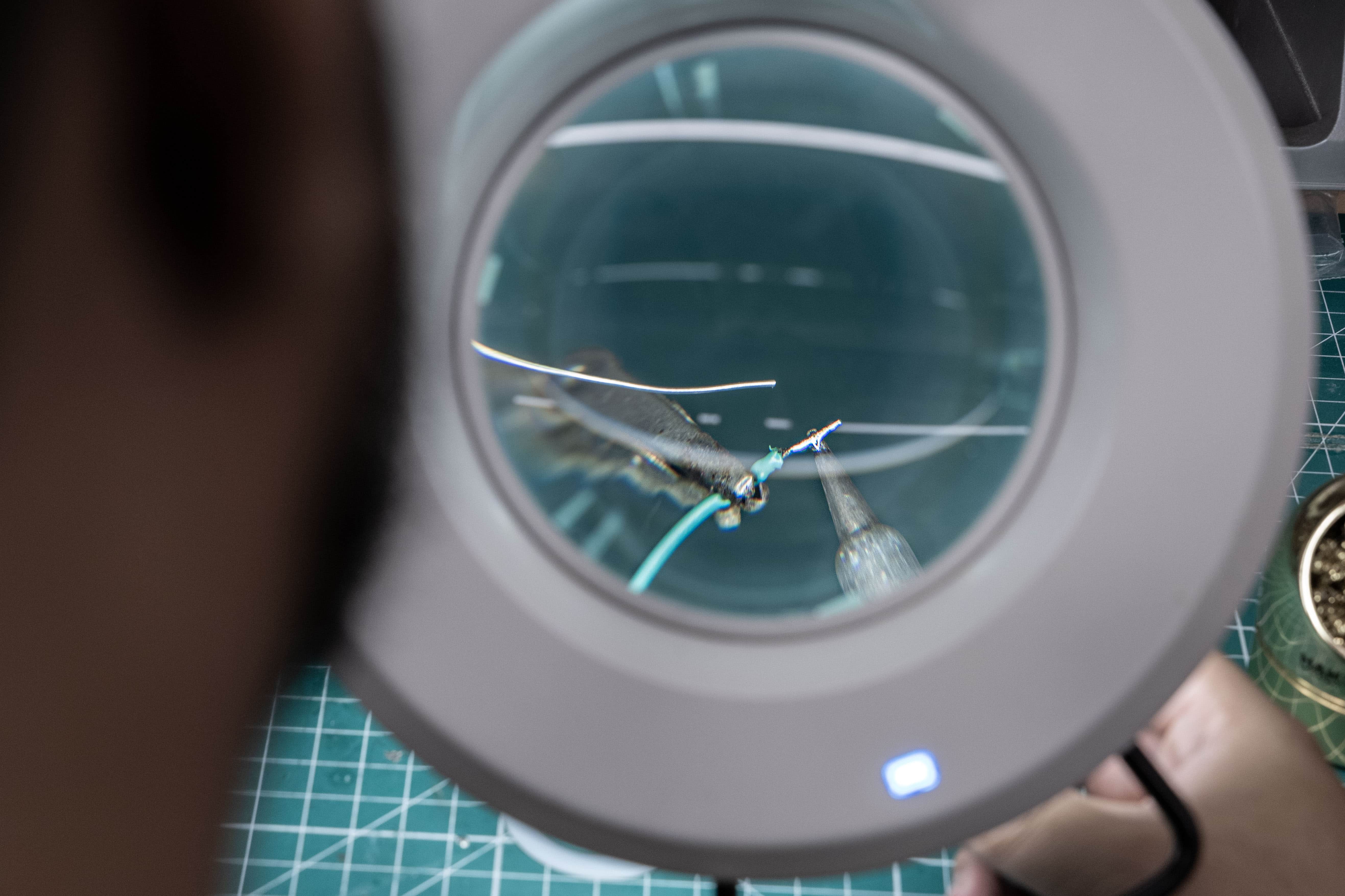 Close up of a student working with tools